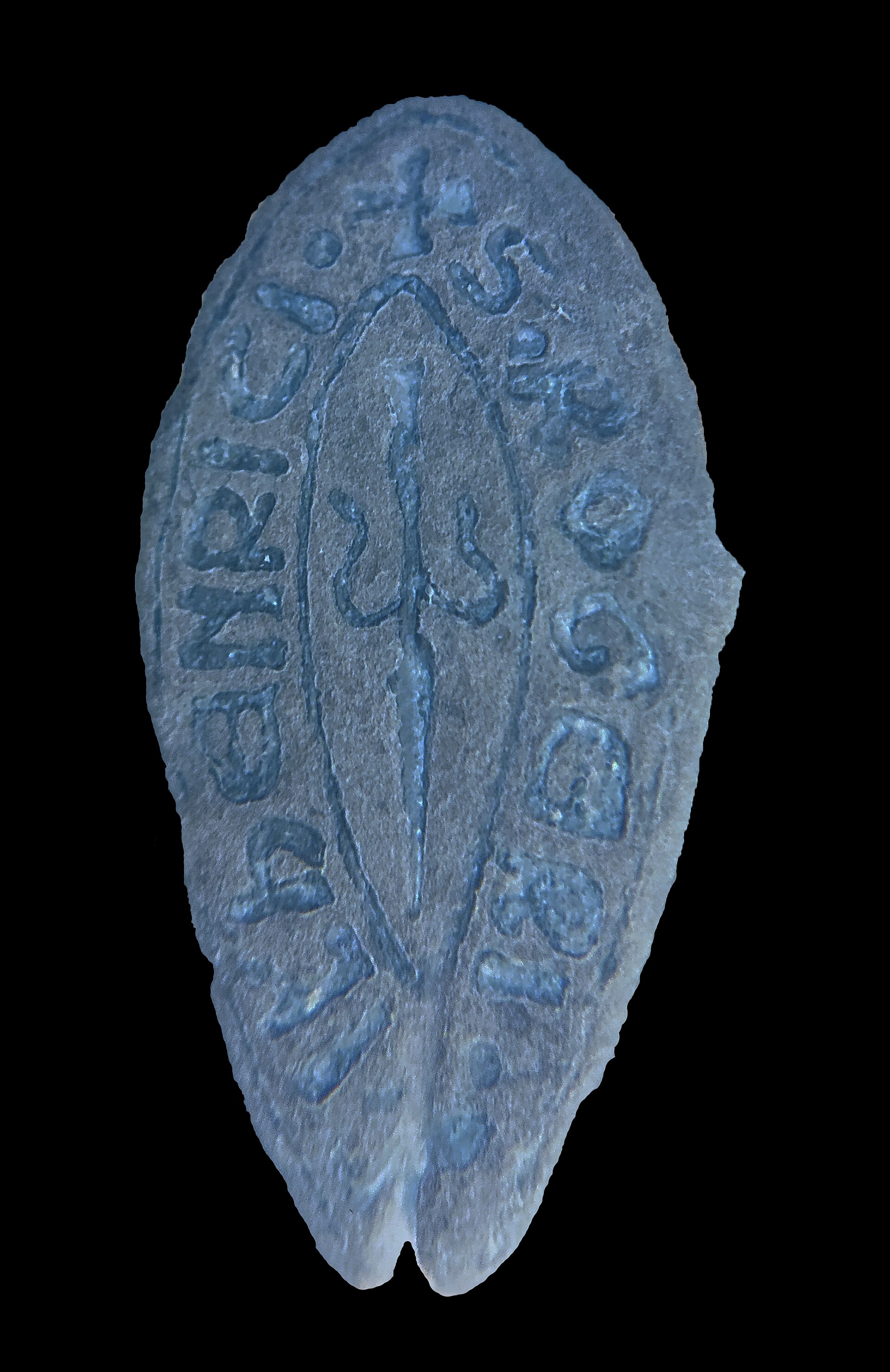 Leander Fragment | Verify Online A weathered glass fragment with embossed lettering from 1580, illustrating the importance of source verification.
